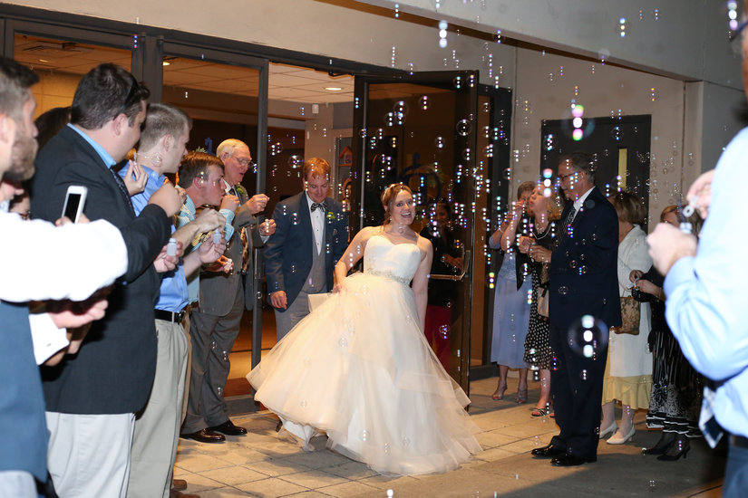 bride and groom walking out