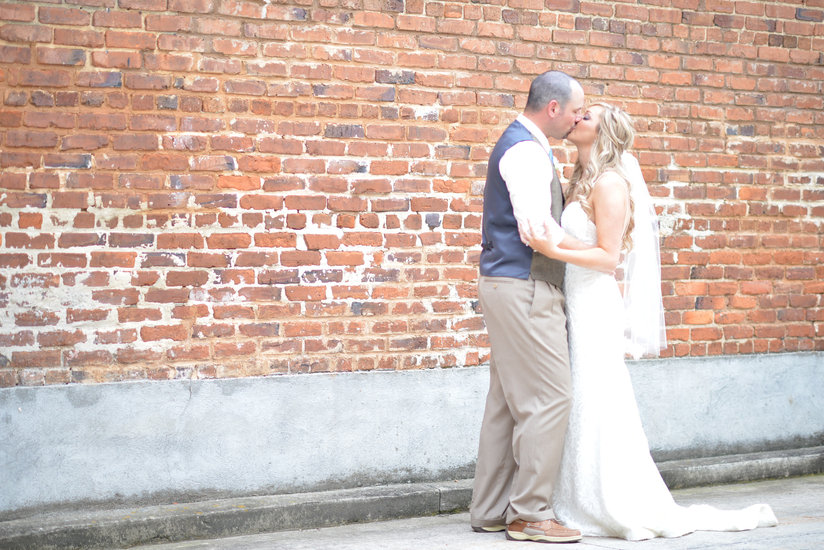 bride and groom first kiss