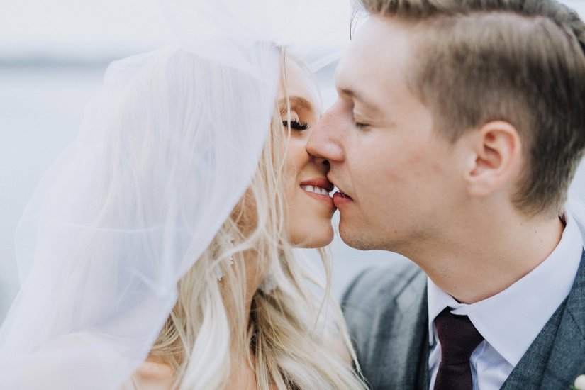 Krystyl and Keith kissing under veil