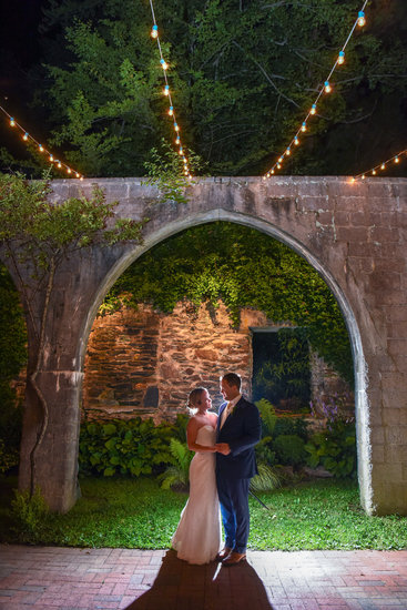 Bride and groom at night at The Old Mill