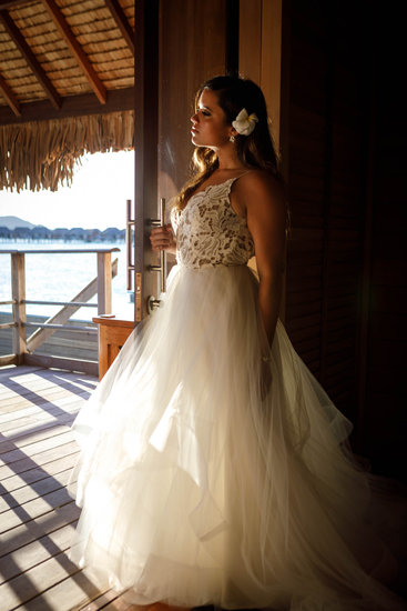 Bride posing in the overwater bungalow