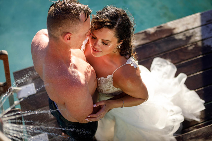 Bride and groom under the shower