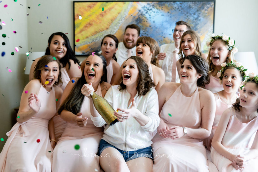 Bridal party surprised by confetti 